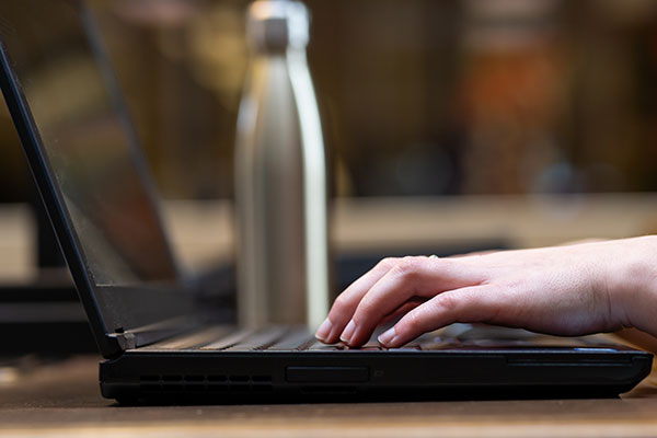 Fingers on a keyboard.