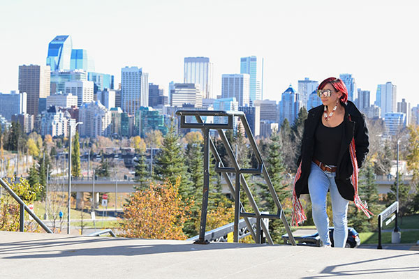 A student walking up a staircase outdoors