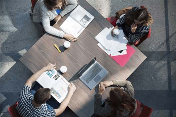 Students studying at a table
