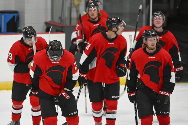 Trojans hockey players on ice