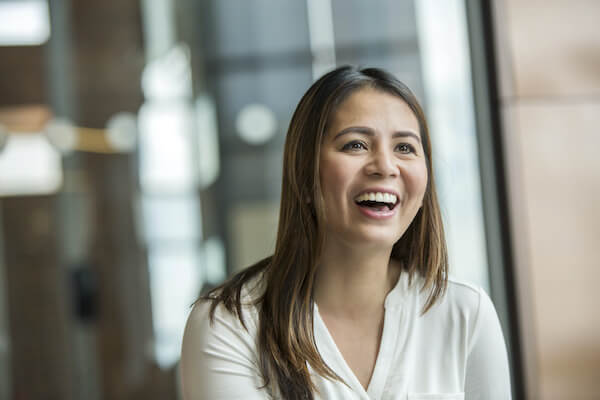 women smiles towards the camera