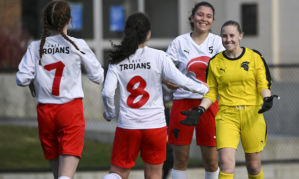 A group of soccer players celebrating