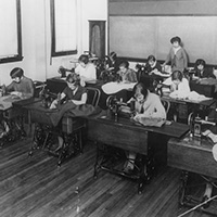 Women sewing in a classroom.