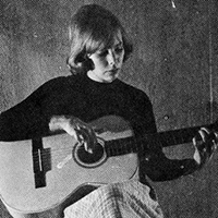 SAIT student Joni Anderson playing guitar.