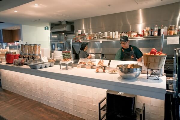 Two chefs working behind a counter in the Dining Centre