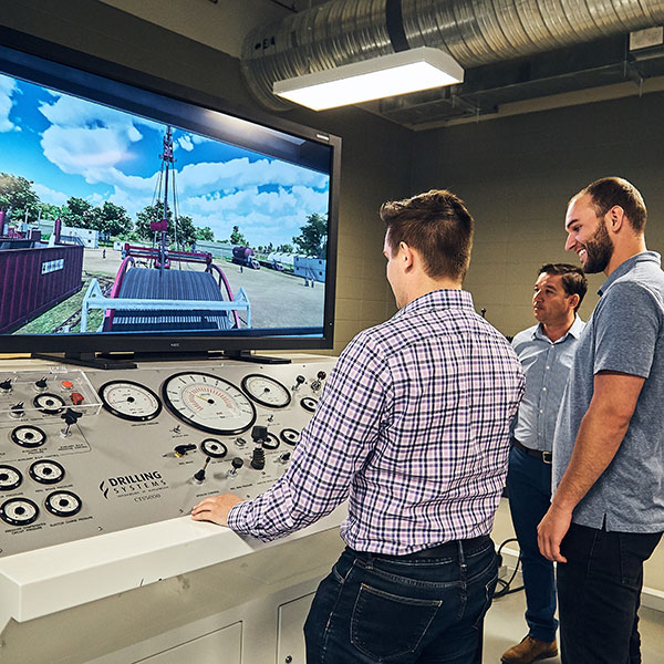 A SAIT student learns on a simulator in the Johnson-Cobbe Energy Centre.