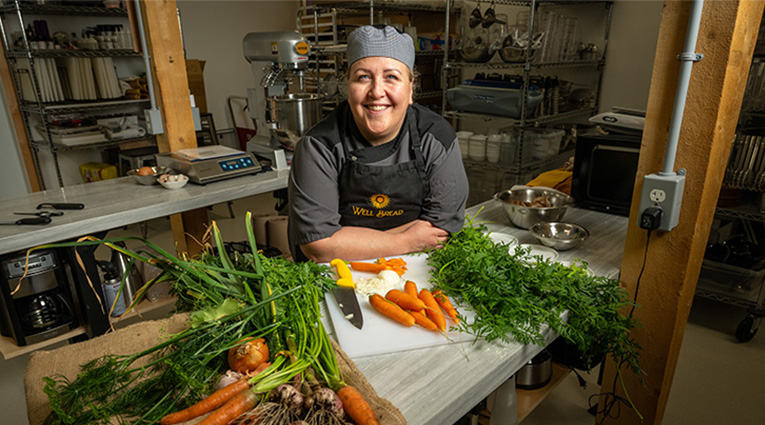chef in kitchen preparing a meal
