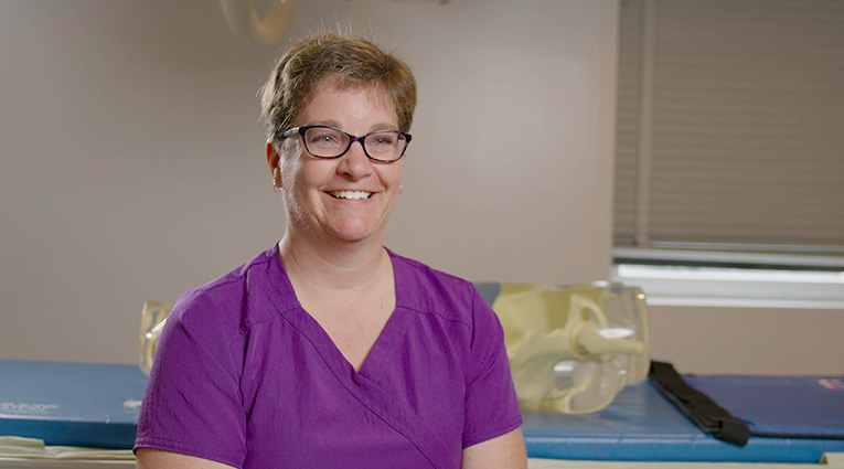 woman in purple scrubs