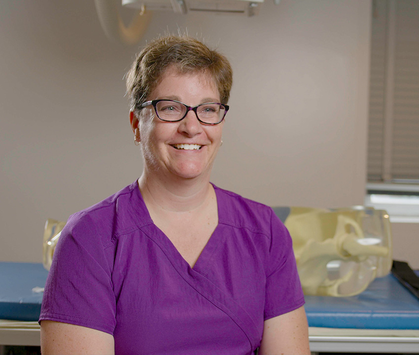 woman in purple scrubs