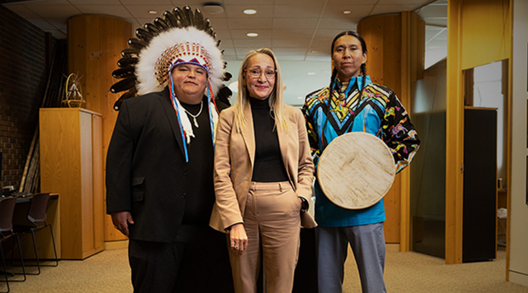Three Indigenous and Métis people standing together