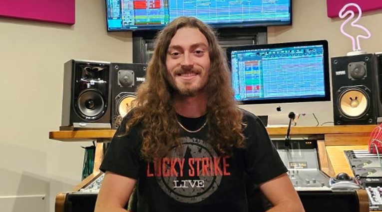 A person sitting in a recording studio
