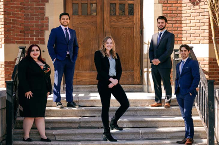 SIMT students in front of building