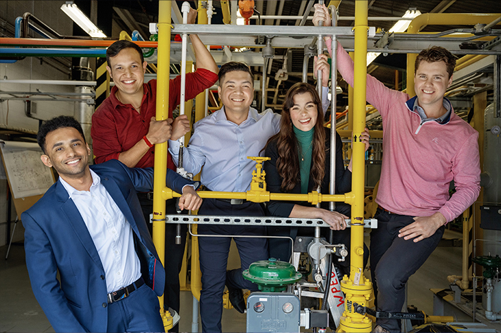 students smiling in a lab