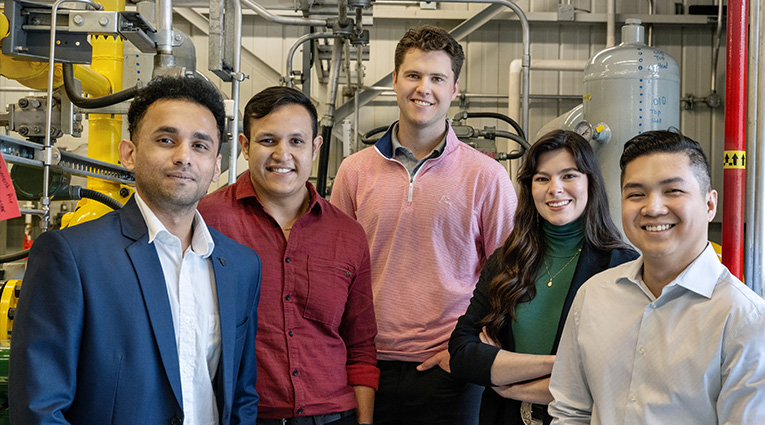 Group of diverse students posing in lab