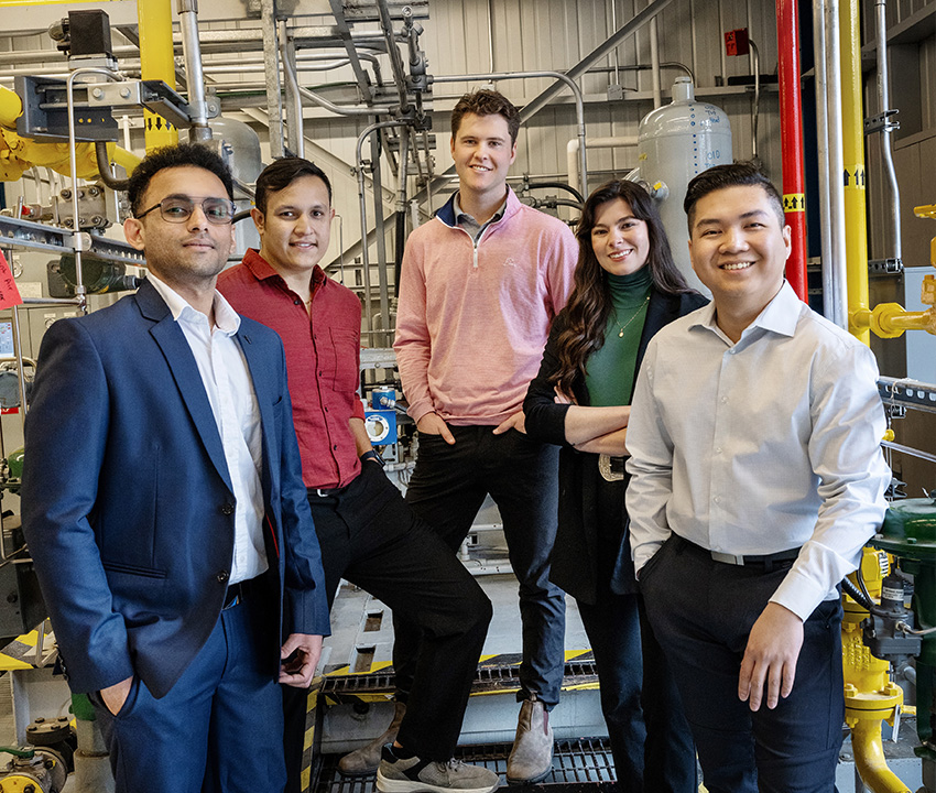 Group of diverse students posing in lab