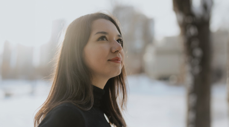 young woman looking off camera in the winter